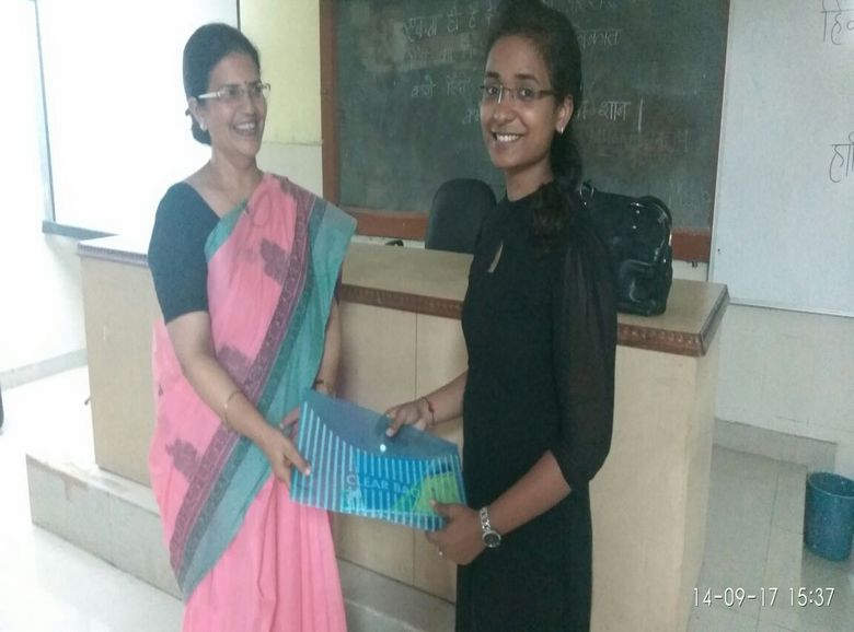 SEL President, Prof. Rastogi with the winner of the language competition, Ms. Pankhuri Agarwal
