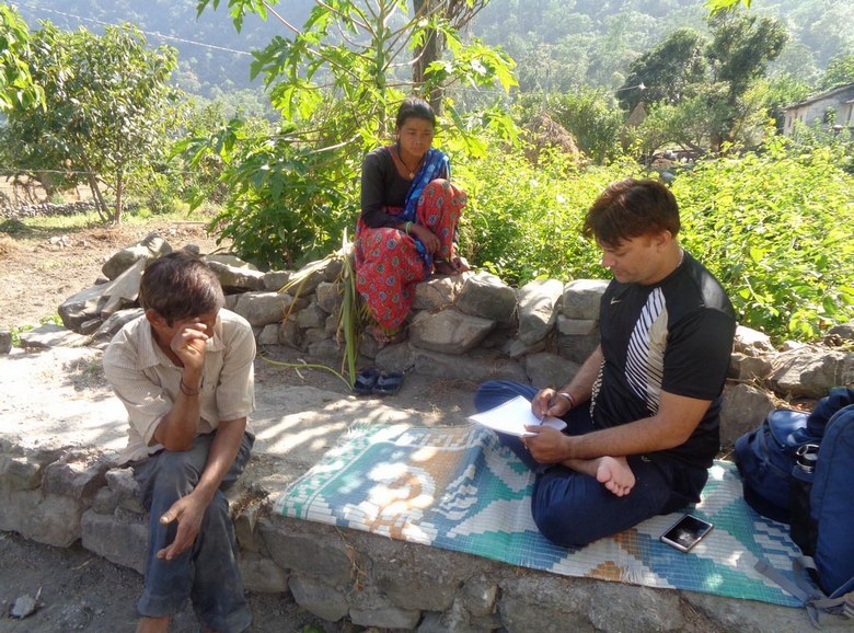 Dr. Vishnu Singh with a Raji family